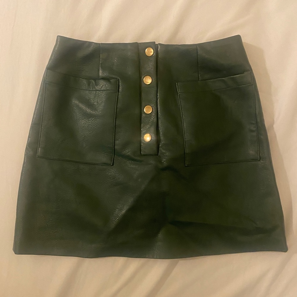 Retro vintage dark green leather mini skirt with buttons and pockets